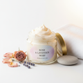 Whipped body butter in elegant glass jar with rose petals